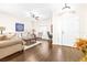 Living room with hardwood floors, neutral colors, and ample natural light at 4012 Beaumont Loop, Spring Hill, FL 34604