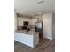Modern kitchen featuring stainless steel appliances and granite countertops at 4596 Pleasant Ave, Palm Harbor, FL 34683