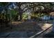 Large backyard with a pergola and mature trees providing shade at 4700 18Th N Ave, St Petersburg, FL 33713