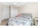 Spacious bedroom with a gray headboard and built in closet at 702 E Gilchrist St, Plant City, FL 33563