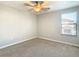 Well-lit bedroom featuring carpeted floors and a window at 925 Terra Vista St, Brandon, FL 33511