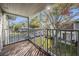 Spacious balcony overlooks the community with treetop and parking views at 10800 Us 19 N. # 230, Pinellas Park, FL 33782