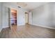 Bright bedroom with ample closet space and wood-look flooring at 10800 Us 19 N. # 230, Pinellas Park, FL 33782