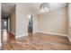 Light and airy dining room with wood-look floors and modern chandelier at 10800 Us 19 N. # 230, Pinellas Park, FL 33782