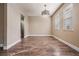 Bright dining area with wood-look floors and modern light fixture at 10800 Us 19 N. # 230, Pinellas Park, FL 33782