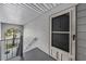 Private entryway with exterior door and stairway at 10800 Us 19 N. # 230, Pinellas Park, FL 33782