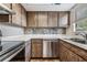Modern kitchen with stainless steel appliances and wood cabinets at 10800 Us 19 N. # 230, Pinellas Park, FL 33782