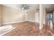 Bright living room features wood-look floors and ceiling fan at 10800 Us 19 N. # 230, Pinellas Park, FL 33782
