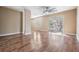 Spacious living room with wood-look floors and access to balcony at 10800 Us 19 N. # 230, Pinellas Park, FL 33782