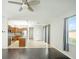 Open concept kitchen with island, stainless steel appliances, and granite countertops at 10836 Carloway Hills Dr, Wimauma, FL 33598