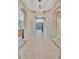 Spacious entryway with tile floors and a crystal chandelier at 11519 Coventry Grove Circle, Lithia, FL 33547