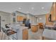 Modern kitchen with a breakfast bar, granite countertops, and black appliances at 11519 Coventry Grove Circle, Lithia, FL 33547