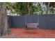 Charming backyard with wooden swing under trees at 11747 104Th St, Largo, FL 33773