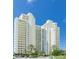 Elegant high-rise building with ample parking and lush landscaping at 1200 Gulf Blvd # 1104, Clearwater Beach, FL 33767