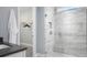 Bright bathroom with a walk-in shower and closet at 12158 Meditation Trl, Venice, FL 34293