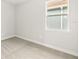 This bedroom features neutral carpeting and a window that allows natural light at 12170 Meditation Trl, Venice, FL 34293
