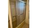 This bathroom features a shower with textured glass sliding doors and green tile surround at 13225 101St St # 451, Largo, FL 33773