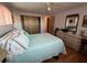 Cozy bedroom featuring wood-look floors, a ceiling fan, and closet at 13225 101St St # 451, Largo, FL 33773