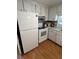 Functional kitchen with white appliances, classic cabinets, and a clean, bright atmosphere for cooking at 13225 101St St # 451, Largo, FL 33773