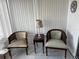 Bright sunroom featuring two chairs, a table, and a window with white blinds at 13225 101St St # 451, Largo, FL 33773