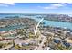 Aerial view of a house near the water, showcasing its neighborhood setting at 13995 Island Dr, Madeira Beach, FL 33708