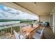 Outdoor balcony dining area with water views, ideal for entertaining at 19519 Gulf Blvd # 603, Indian Shores, FL 33785