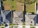 Overhead view of houses with well-kept lawns and driveways, showcasing their layout and neighborhood setting at 21291 Snowy Orchid Ter, Land O Lakes, FL 34637