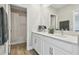 Stylish bathroom with double sinks, quartz countertops, and a shower-tub combination at 21291 Snowy Orchid Ter, Land O Lakes, FL 34637