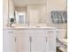 Bathroom with white vanity, quartz countertop, and toilet at 21291 Snowy Orchid Ter, Land O Lakes, FL 34637