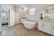 Spacious bathroom with a large soaking tub and double vanity at 21291 Snowy Orchid Ter, Land O Lakes, FL 34637