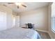 Bedroom with bed, desk, and ceiling fan at 21291 Snowy Orchid Ter, Land O Lakes, FL 34637