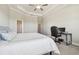 This primary bedroom suite with an ensuite bath features a tray ceiling and plush carpet at 21291 Snowy Orchid Ter, Land O Lakes, FL 34637