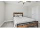Bedroom with ceiling fan and wood bed frame at 21291 Snowy Orchid Ter, Land O Lakes, FL 34637