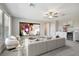 Home theater media room with comfortable seating, wet bar, beverage refrigerator, and a large screen at 21291 Snowy Orchid Ter, Land O Lakes, FL 34637