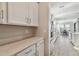 Kitchen with white cabinets and quartz countertops at 21291 Snowy Orchid Ter, Land O Lakes, FL 34637