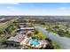 Aerial view showing community amenities including pool and clubhouse at 2232 Greenwich Dr # 56, Sun City Center, FL 33573