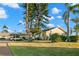 Single-story home with carport and lush landscaping at 2232 Greenwich Dr # 56, Sun City Center, FL 33573