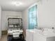 Functional laundry room with golf cart and a window at 2232 Greenwich Dr # 56, Sun City Center, FL 33573