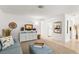 Open-concept living area with neutral carpet, light blue furniture, and natural light at 2232 Greenwich Dr # 56, Sun City Center, FL 33573