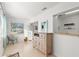Sunlit room featuring tiled floors, comfortable seating, and natural light at 2232 Greenwich Dr # 56, Sun City Center, FL 33573