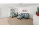Living room with light blue sofas and entryway view at 2232 Greenwich Dr # 56, Sun City Center, FL 33573