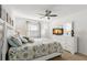 Main bedroom with white dresser and floral bedding at 2232 Greenwich Dr # 56, Sun City Center, FL 33573
