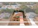 Aerial view showing a single Gathering home with a pool in a residential neighborhood at 2318 Landover Blvd, Spring Hill, FL 34608