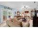 Living Room with corduroy sofas, a coffee table, and access to a patio at 2318 Landover Blvd, Spring Hill, FL 34608