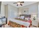 Comfortable bedroom with a queen-size bed and plenty of closet space at 2410 Nottingham Greens Dr, Sun City Center, FL 33573