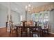 Elegant dining room with a large wooden table and chairs at 28424 Openfield Loop, Wesley Chapel, FL 33543