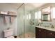 Modern bathroom with glass shower and dark vanity at 3014 Samara Dr, Tampa, FL 33618