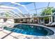 Inviting pool area with covered patio and lounge chairs at 3014 Samara Dr, Tampa, FL 33618