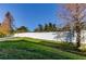 Backyard with grassy area and tall privacy fence at 31225 Claridge Pl, Wesley Chapel, FL 33543
