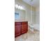 Bathroom with tub, toilet, and wood vanity at 31225 Claridge Pl, Wesley Chapel, FL 33543